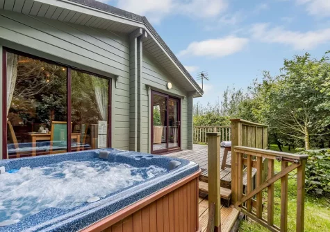 The hot tub & decked patio at Monterey Lodge, Forest Lakes, Woolfardisworthy