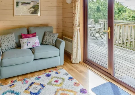 Monterey Lodge, Forest Lakes, Woolfardisworthy is a peaceful three-bedroom woodland retreat featuring private hot tub, children's play area, and easy access to North Devon's stunning coast and attractions, perfect for memorable family holidays.