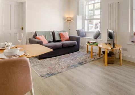 Mor Apartment, Looe is a charming retreat for two, tucked along a quiet brick lane in the heart of this beloved Cornish fishing town, with Scandi-style interiors, cosy window seats, and the beach, cafes and coast path just moments from your door.