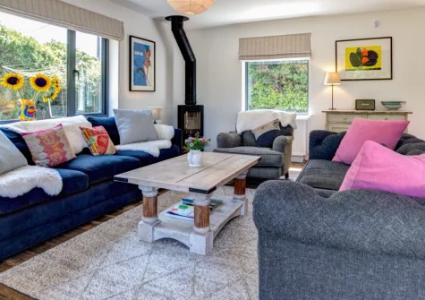 Morlanar, Trevone is a spacious four-bedroom bungalow just metres from beautiful Trevone Bay Beach, featuring a cosy wood burner, generous enclosed garden with fire pit, and easy access to Padstow's excellent restaurants and coastal walks.