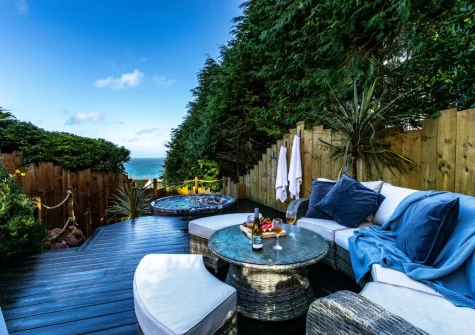 The decked patio, outdoor sitting area & hot tub at Morva, Carbis Bay