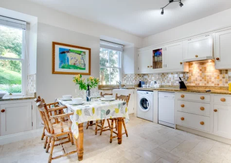 The kitchen & dining area at Morvah, 7 Zodiac House, Porthcurno