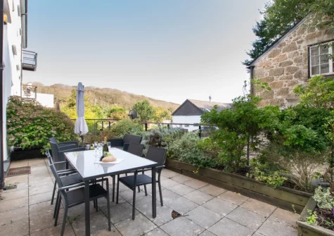 The rear terrace garden & alfresco dining area at Morvah, 7 Zodiac House, Porthcurno