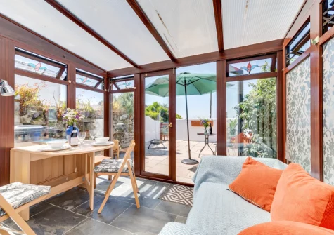 The conservatory dining & sitting area at Morvoren Cottage, Trewellard