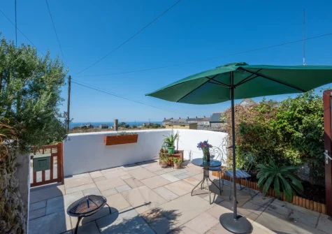 The patio & outdoor sitting area at Morvoren Cottage, Trewellard