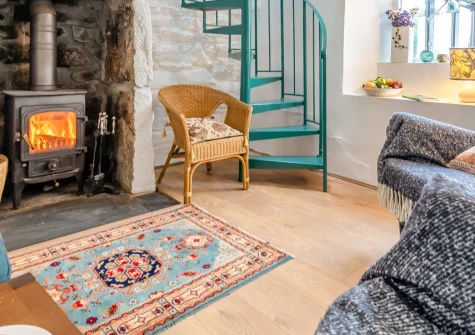 Morvoren Cottage, Trewellard is a romantic one-bedroom retreat moments from Geevor's UNESCO mining heritage, boasting sea views to the Scilly Isles, a cosy wood burner, sun-filled conservatory and a secluded firepit patio for blissful escapes.