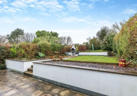 The enclosed tiered garden with patio, barbecue & alfresco dining area at Mount Rose, Woolacombe
