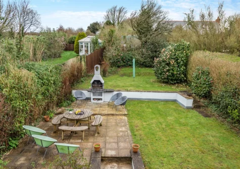 The enclosed tiered garden with patio, barbecue & alfresco dining area at Mount Rose, Woolacombe