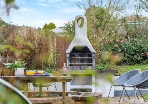 The enclosed tiered garden with patio, barbecue & alfresco dining area at Mount Rose, Woolacombe