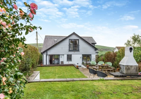 The enclosed tiered garden with patio, barbecue & alfresco dining area at Mount Rose, Woolacombe