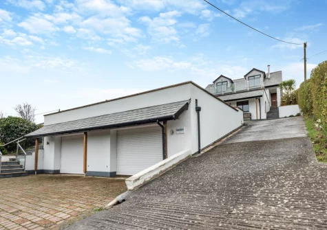 Mount Rose has outdoor spaces for everyone to enjoy, including three balconies, two patios, an enclosed tiered garden & parking for four cars