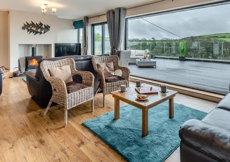 Mount Rose, Woolacombe, is a stunning six-bedroom contemporary home with breathtaking panoramic ocean views. Enjoy three private balconies, tiered gardens, and easy access to world-class beaches. Perfect for unforgettable family gatherings.