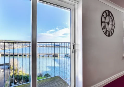 The living area & small balcony at Mount View, Penzance