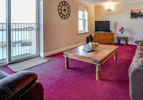 Mount View, Penzance is a light-filled two-bedroom apartment with a private balcony overlooking the harbour and Mount's Bay, spacious living areas, a free-standing bath, and easy access to galleries, caf&eacute;s and the Scilly Isles ferry, just steps away