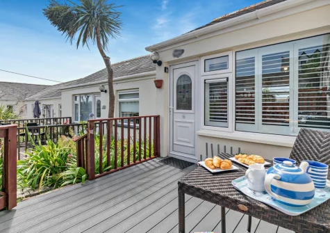 The decked patio & outdoor sitting area at Mullion Kingfisher, Mullion Cove