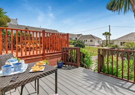 The decked patio & outdoor sitting area at Mullion Kingfisher, Mullion Cove