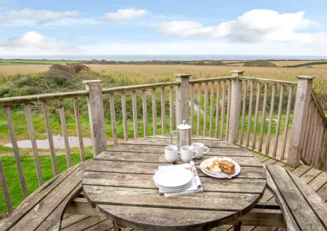 The balcony & alfresco dining area at Munnings Barn at Tregurnow Farm, Lamorna
