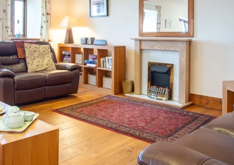 Munnings Barn at Tregurnow Farm, Lamorna is a spacious four-bedroom reverse-level barn conversion offering sweeping countryside views, a private balcony, and a short walk to Lamorna Cove and the South West Coast Path for memorable Cornish holidays.