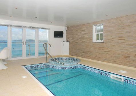 Indoor pool with spa and sauna