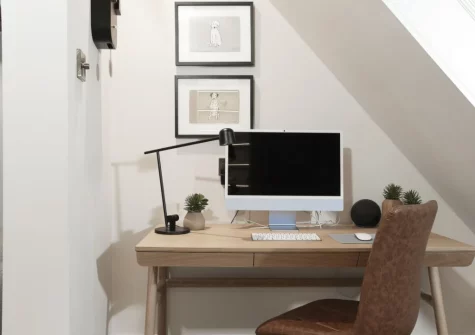 The living area, with compact workspace, at Myrtle Cottage, Mousehole