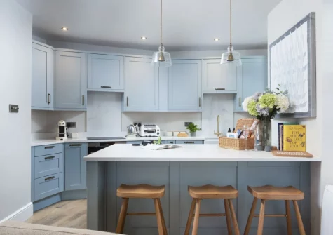 The kitchen, with breakfast bar dining area, at Myrtle Cottage, Mousehole
