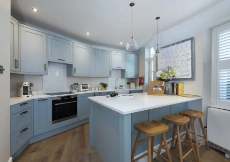 The kitchen, with breakfast bar dining area, at Myrtle Cottage, Mousehole
