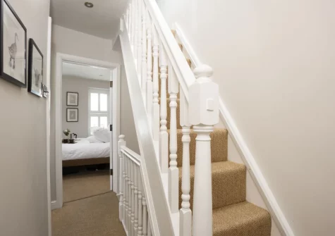 The stairs up to the cozy second floor snug at Myrtle Cottage, Mousehole