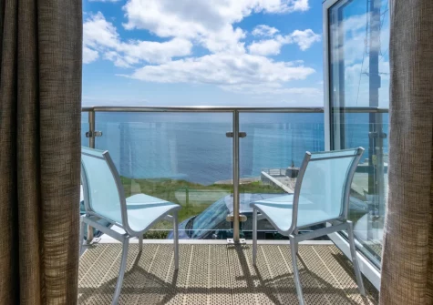 The sea-view balcony & outdoor sitting area at Neptune House, Porthleven