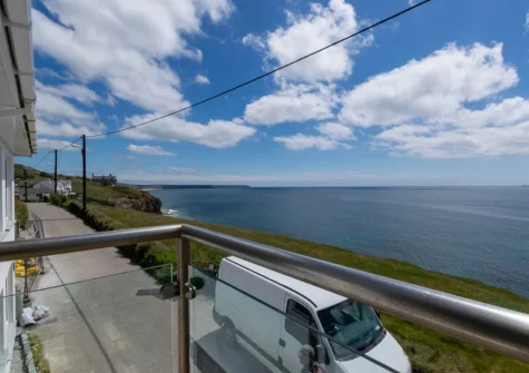 Enjoy far-reaching sea views from the balcony at Neptune House, Porthleven