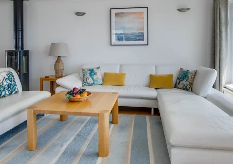Neptune House, Porthleven is a stunning reverse-level cottage with panoramic Mount's Bay views. Enjoy stylish coastal interiors, cosy wood burner warmth, and spectacular balcony access to harbour dining and memorable coastal adventures.
