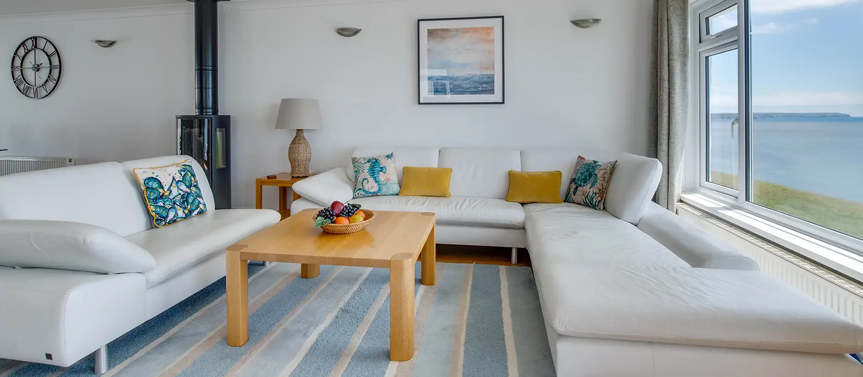 Neptune House, Porthleven is a stunning reverse-level cottage with panoramic Mount's Bay views. Enjoy stylish coastal interiors, cosy wood burner warmth, and spectacular balcony access to harbour dining and memorable coastal adventures.