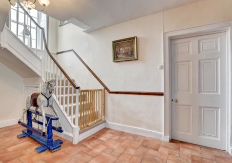 The hallway & stairs up to the first flooe at Nethercott Manor, Rose Ash