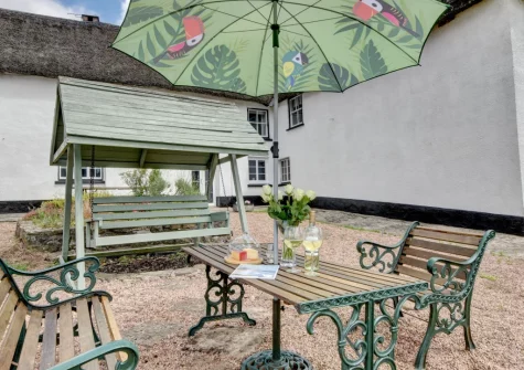 The outdoor sitting area at Nethercott Manor, Rose Ash