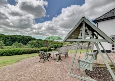 The outdoor sitting area & garden at Nethercott Manor, Rose Ash