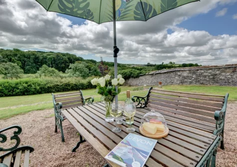 The outdoor sitting area & garden at Nethercott Manor, Rose Ash