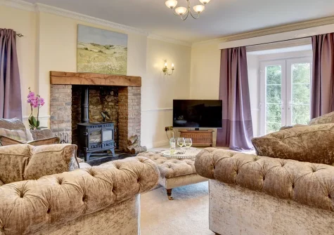 Nethercott Manor, Rose Ash is a two-bedroom wing of a 17th-century thatched Devon farmhouse, set on a magnificent working estate of 160 acres, boasting an Aga kitchen, a wood burner, and sweeping countryside views for a truly special rural escape.