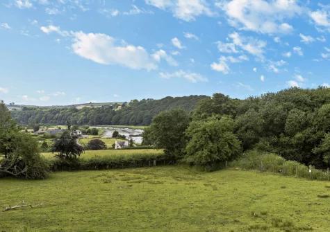 The far eaching countryside views from the decked patio & outdoor sitting area at Netherdowns Shippon, Weare Giffard
