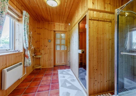 Bedroom #1 en-suite shower room & sauna at Newhaven Cabin, Branscombe