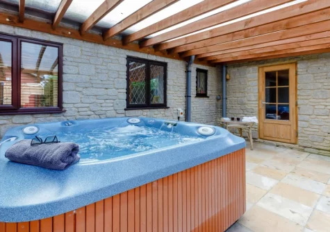 The enclosed patio & hot tub at Newhaven Cabin, Branscombe