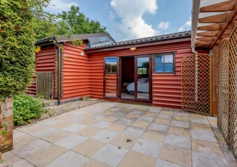 The enclosed patio at Newhaven Cabin, Branscombe