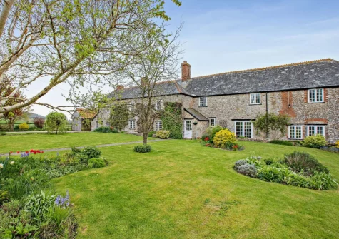 Newhouse is a beautiful traditional Devon longhouse with panoramic views over the rolling countryside & walks direct from the door