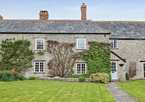 Newhouse is a beautiful traditional Devon longhouse with panoramic views over the rolling countryside & walks direct from the door