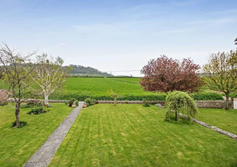 Newhouse is a beautiful traditional Devon longhouse with panoramic views over the rolling countryside & walks direct from the door