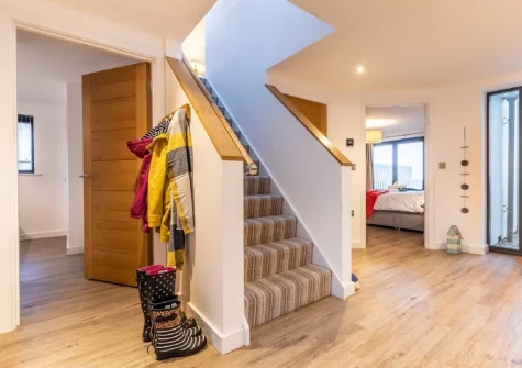 The entrance hallway and stairs up to tthe first floor at No.36 By The Beach, Westward Ho!
