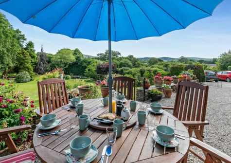 The barbecue & alfresco dining area at North Coombe Farm, Rilla Mill