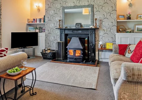 North Coombe Farm, Rilla Mill is a traditional farmhouse on a working farm with spectacular Bodmin Moor views, featuring original Aga kitchen, flower-filled gardens with pond and rowing boat, and easy access to both Cornish coasts.