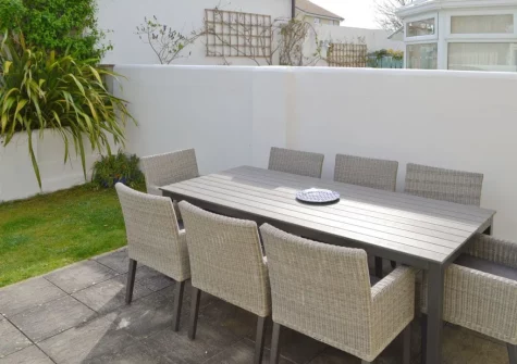 The patio, alfresco dining area & enclosed garden at North Shore, Crantock