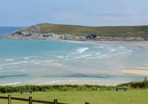Visitors to Crantock Beach enjoy surfing, picnicking and exploring caves & rock pools at low tide