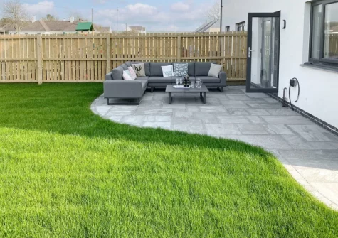 The patio, outdoor sitting area & enclosed lawned gaden at Number 11, St Eval