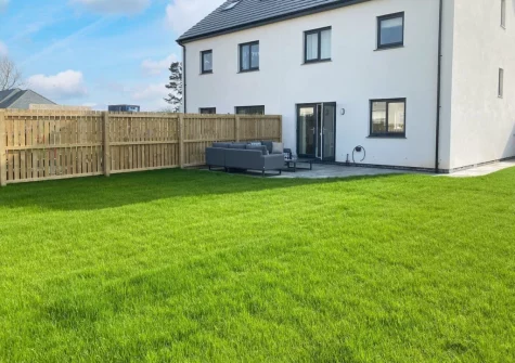 The patio, outdoor sitting area & enclosed lawned gaden at Number 11, St Eval